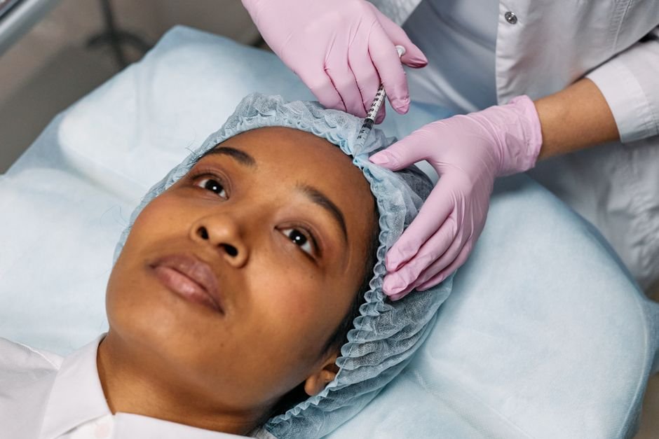 A close-up of a facial injection being administered in a clinical setting